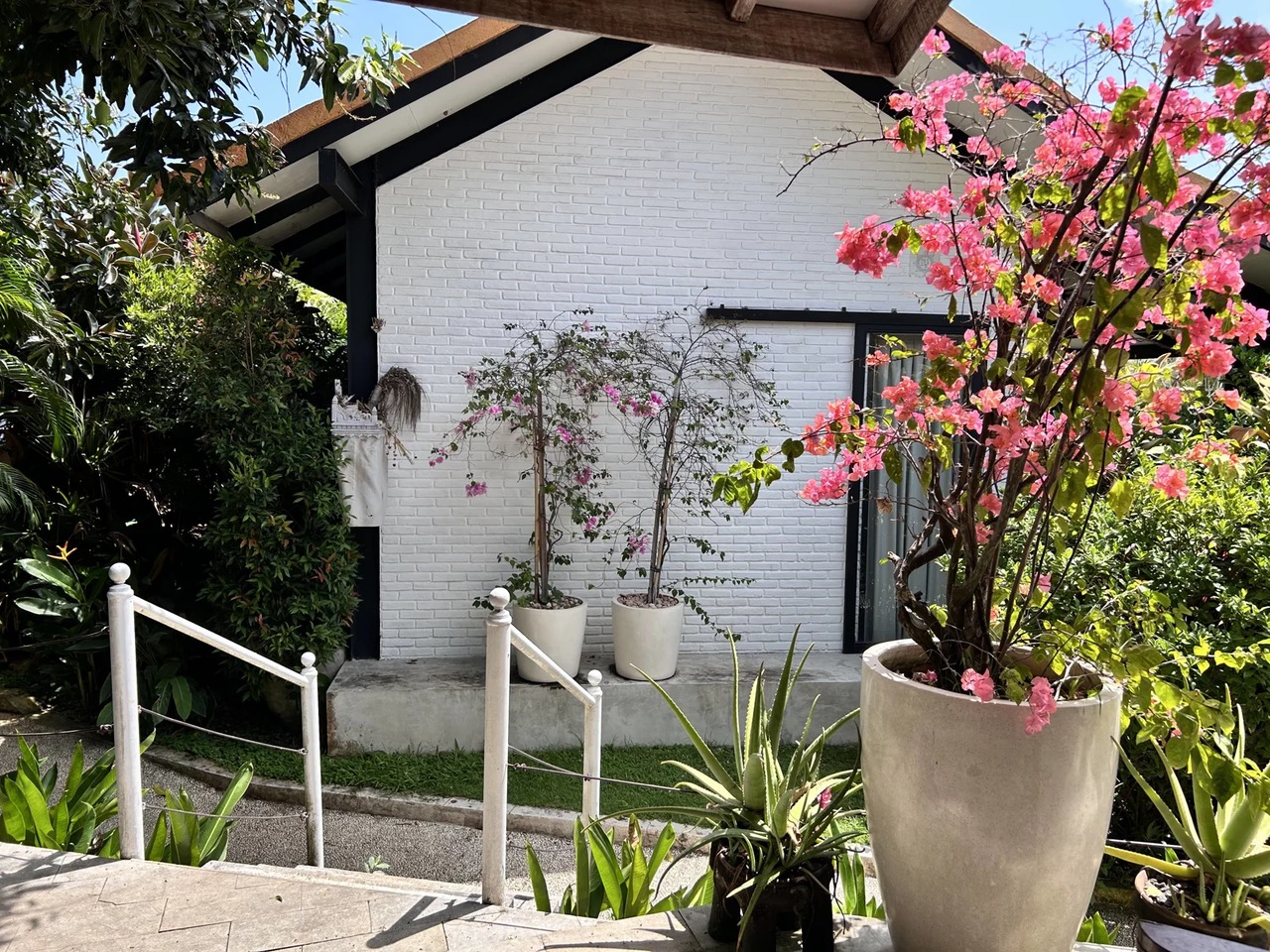 Beach house with lush garden